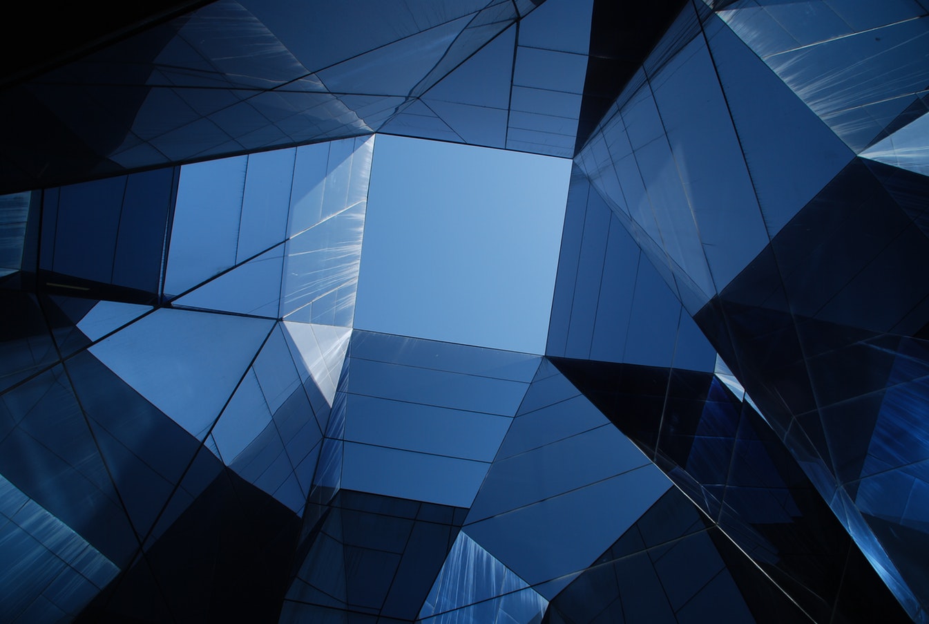 a blue glass ceiling with a skylight